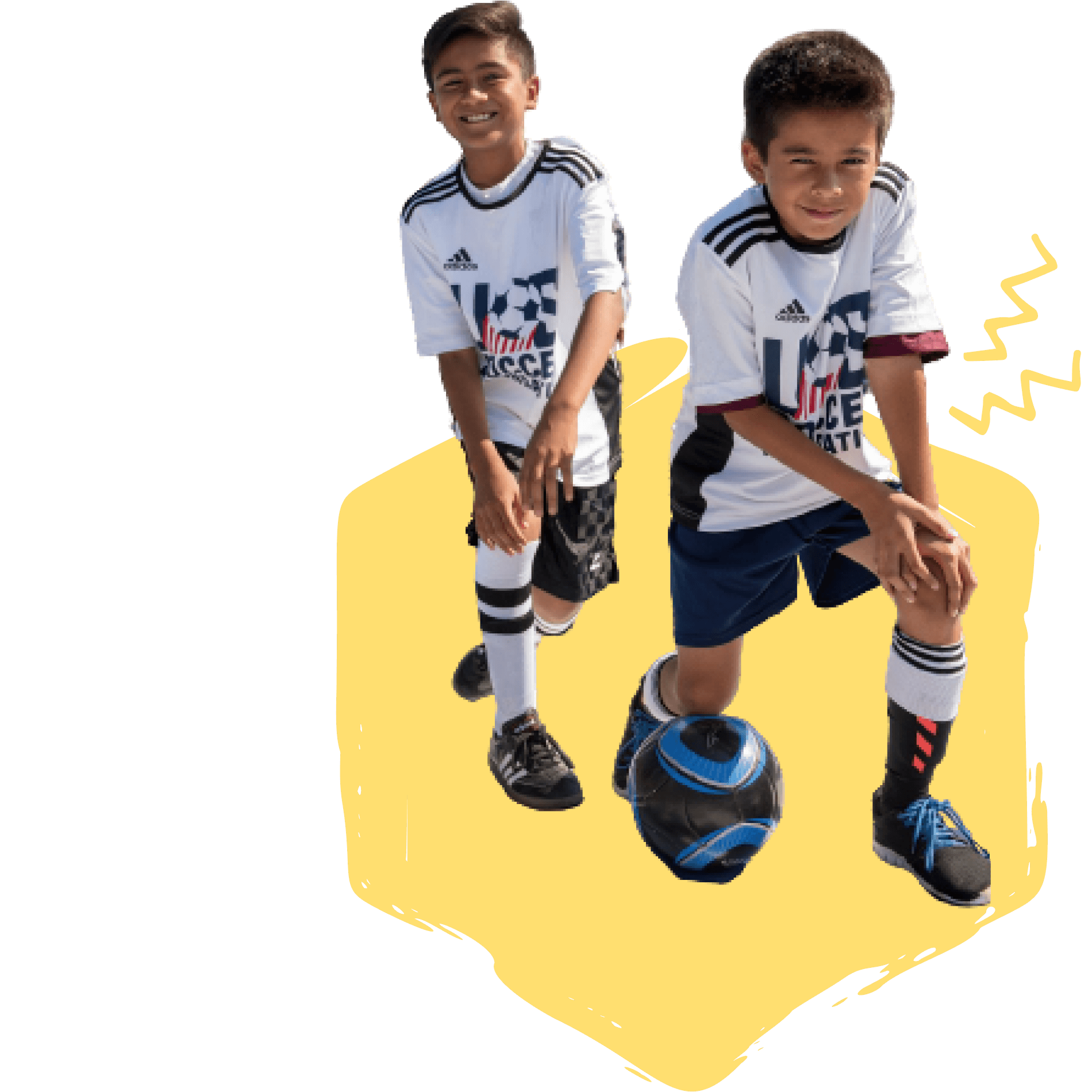 two boys kneeling with a soccer ball